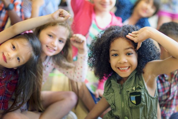 Happy diverse young school kids